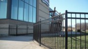 4' tall 3 rail ornamental steel fence with Qual Line made custom arched double gate.