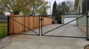 5' vinyl coated chain link driveway gate and 6' Tom Sawyer privacy fence